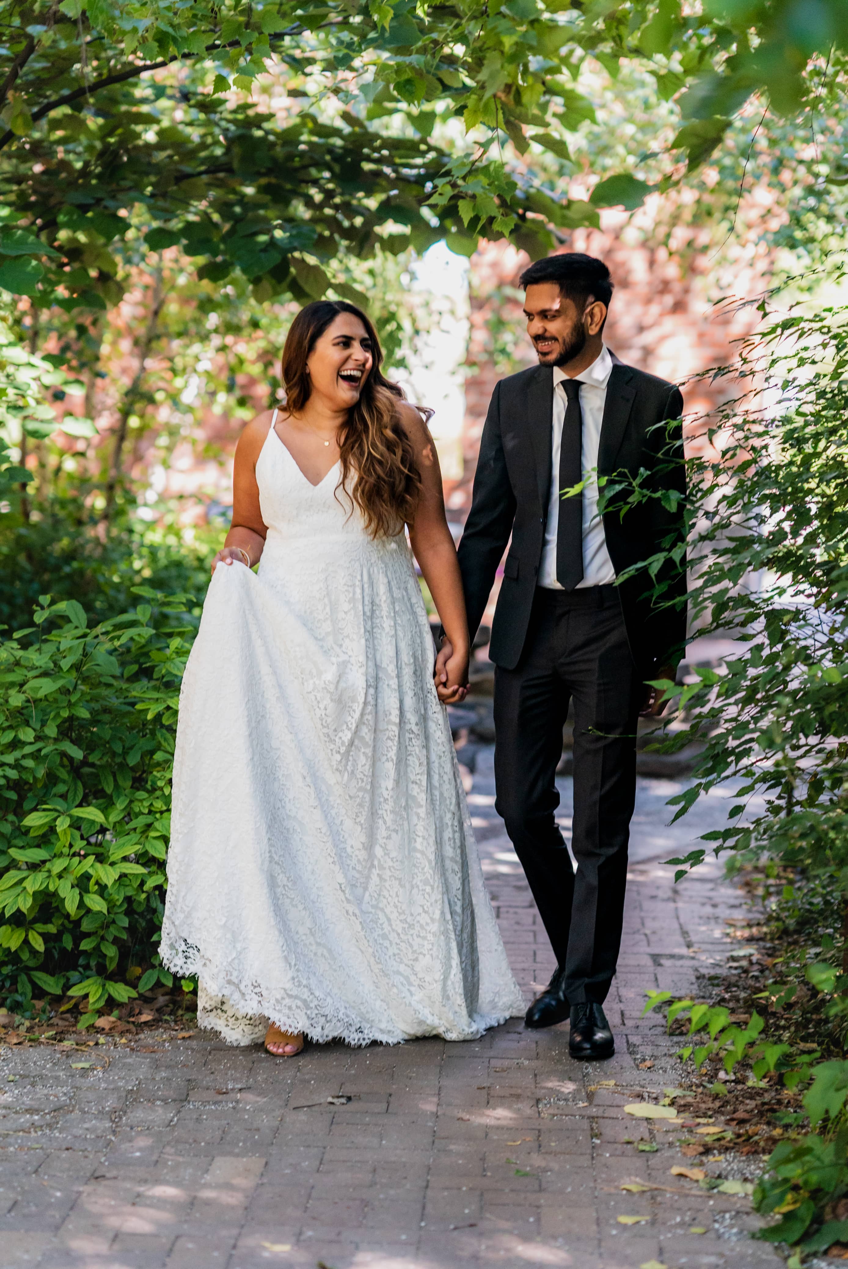 Engaged couple posing close together in soft natural light