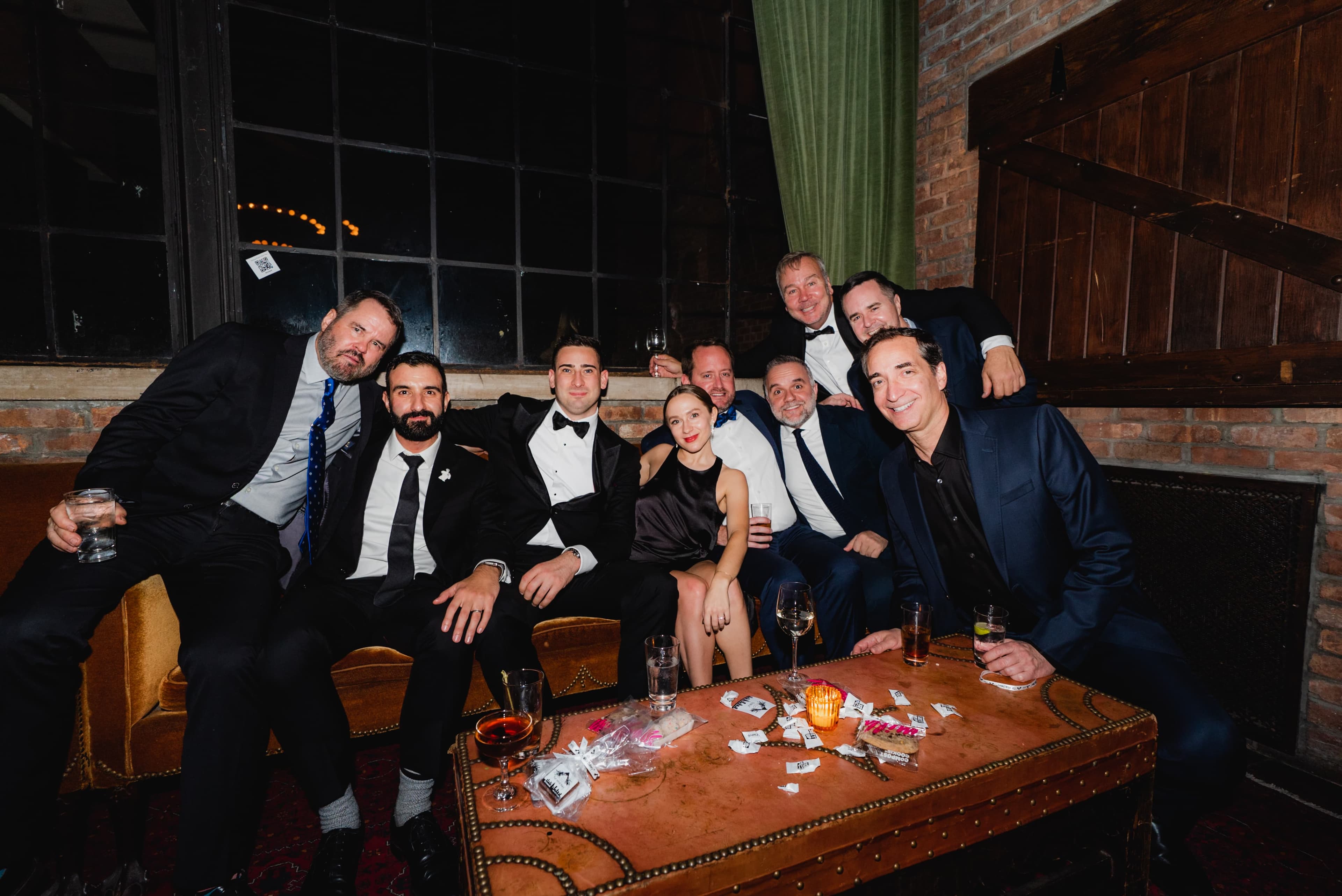 Guests gathered under warm light at an evening gala