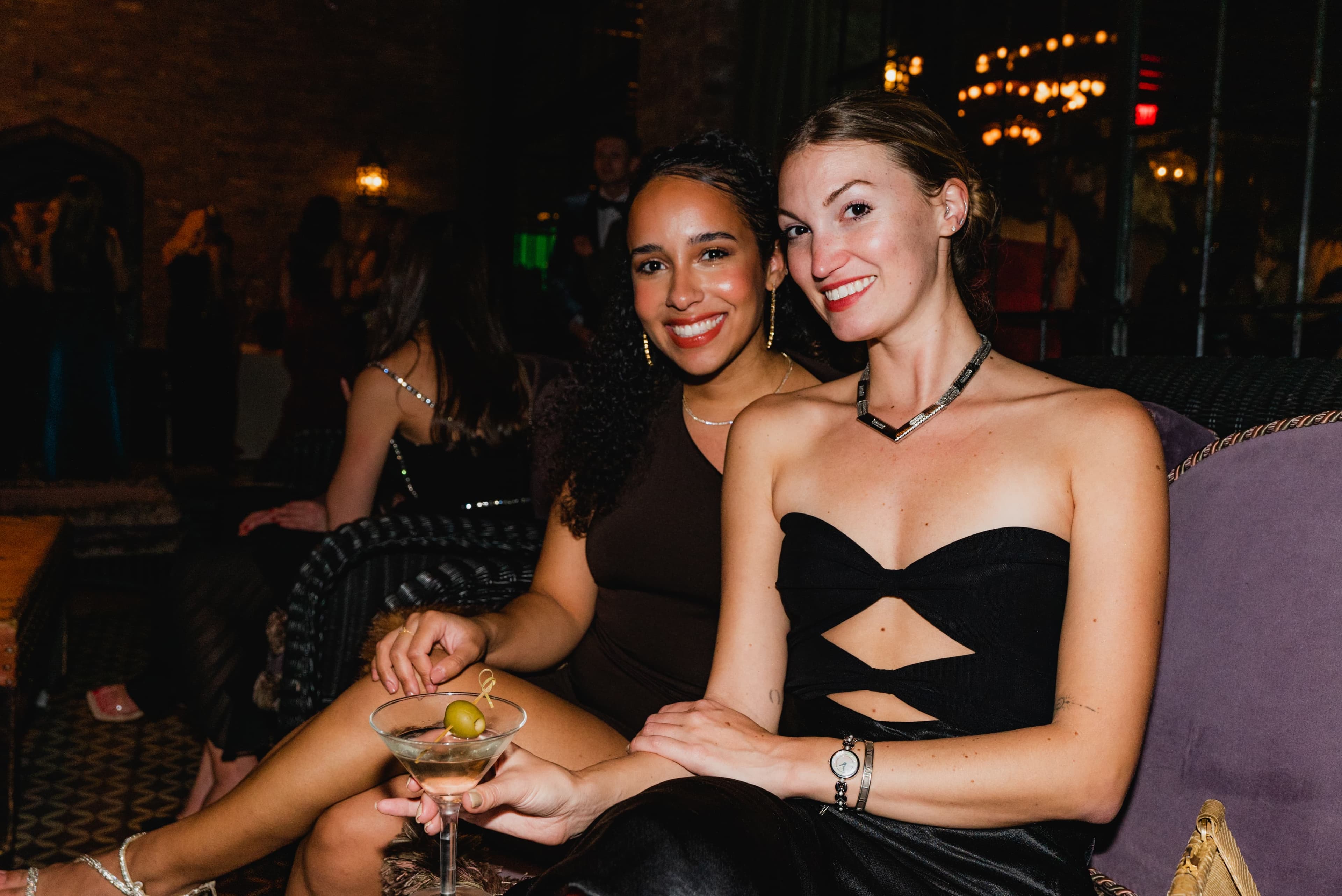 Guests toasting in formalwear at a black-tie gala